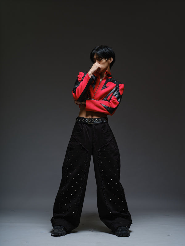 Red denim jacket with pointed black leather patches, mixed-size metal hardware, front zipper and sleeve zippers