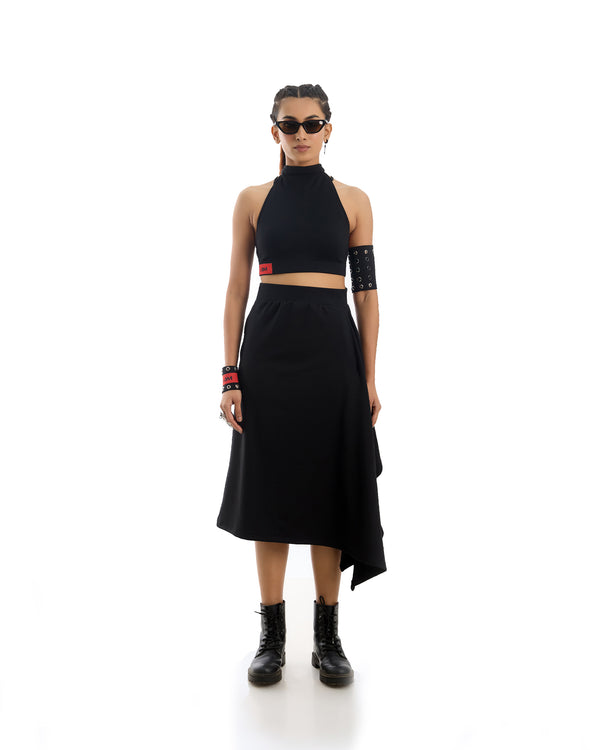 A flowing Midnight Wrap Skirt in a deep, rich fabric, elegantly draped.