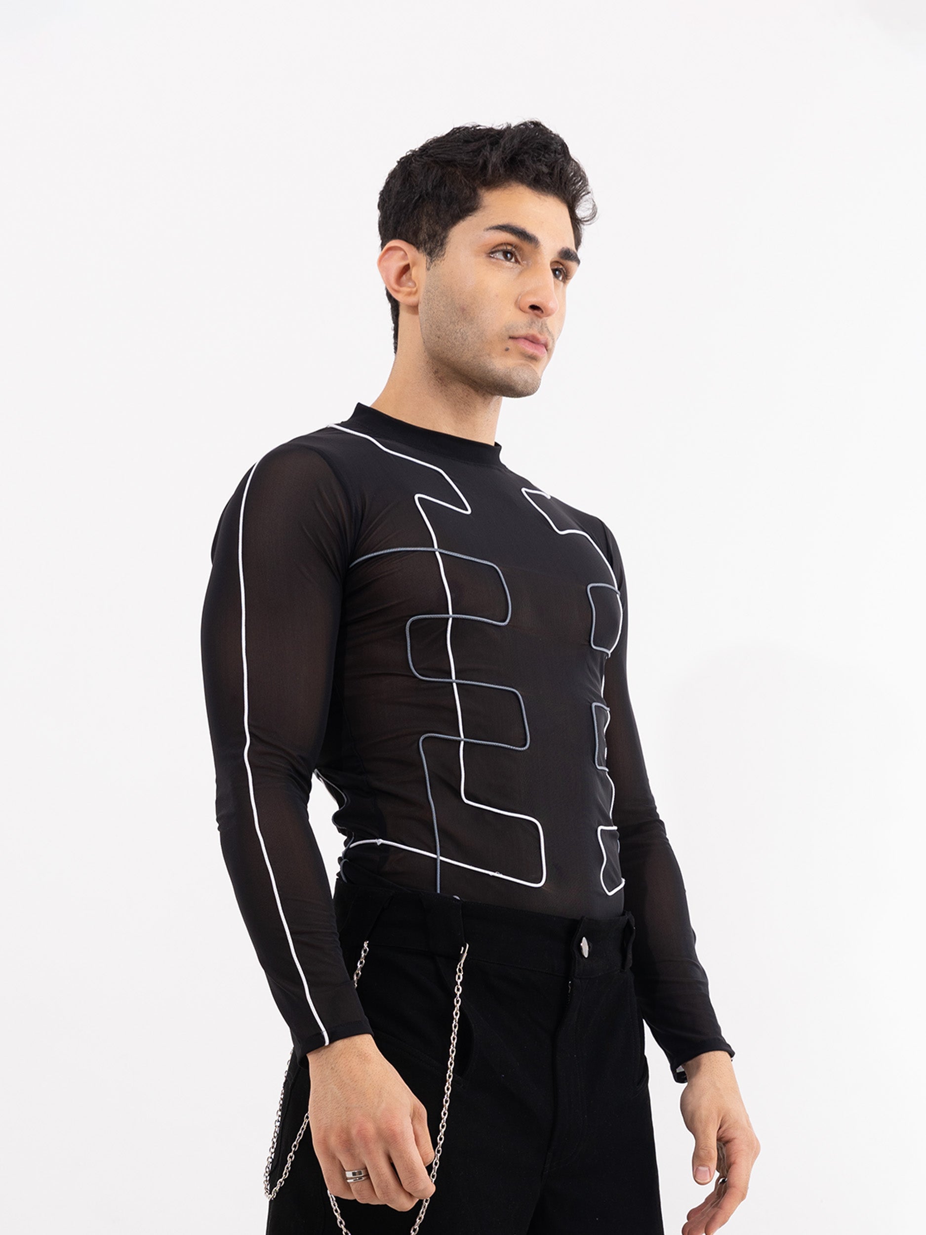 A close-up of the NEUROLINE MESH TOP, showcasing its intricate black mesh fabric with a subtle geometric pattern.