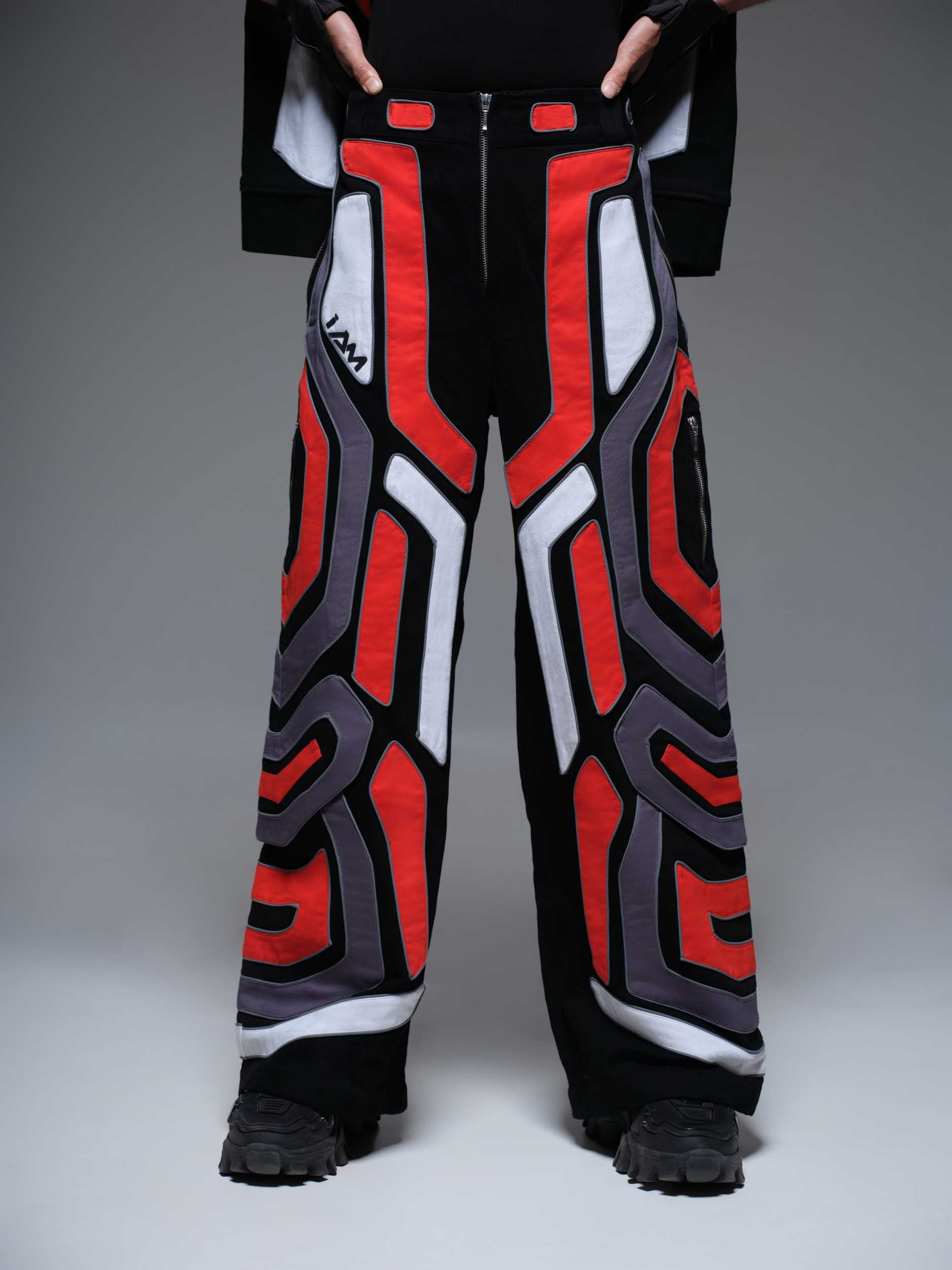 Red Domino Pants: A close-up shot of red pants with a subtle white domino pattern.