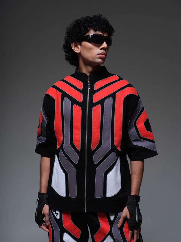 Red Domino Jacket, a vibrant red jacket with black domino dot accents on the sleeves and collar.