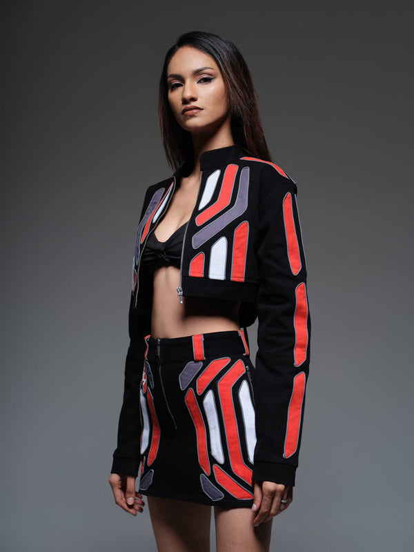 Red Domino crop jacket, a stylish cropped jacket with a bold red domino print, perfect for a statement look.