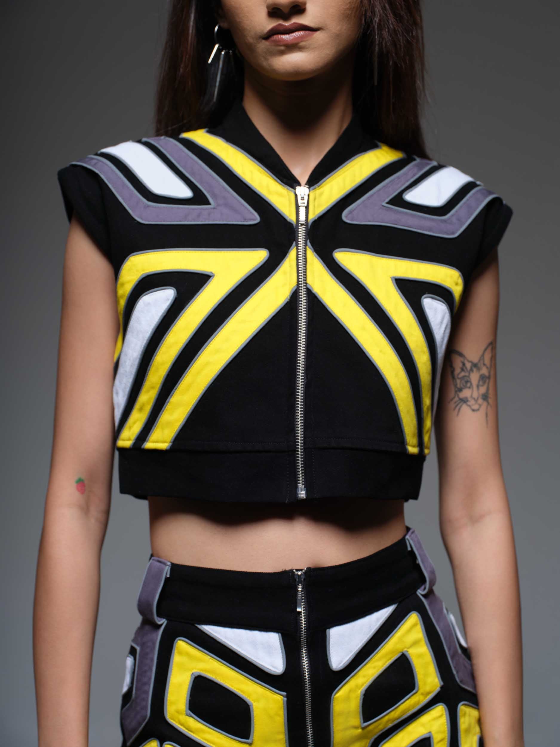 Overdrive Crop Jacket: A stylish black cropped jacket with a zippered front and contrasting white details.