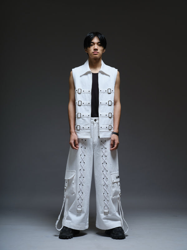 White Riot white denim vest with buckle straps, paired with baggy pants with a side flap pocket and hanging eyelet strap