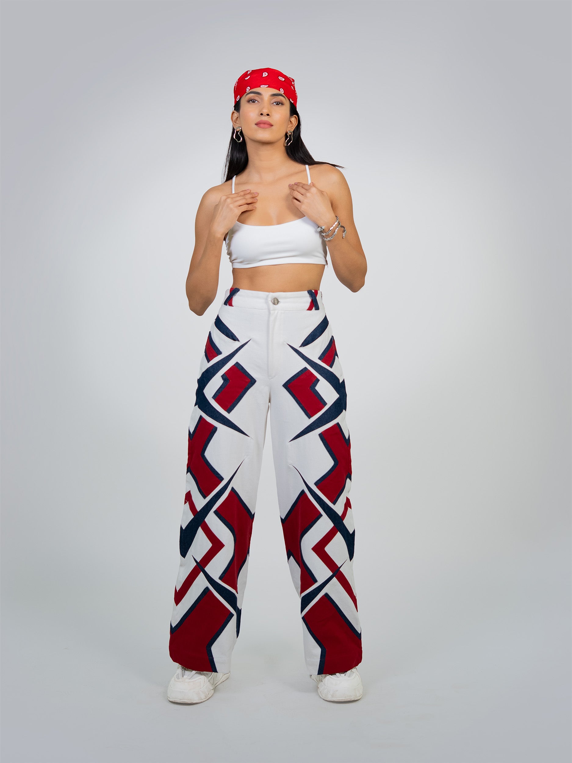 MAZE MATRIX PANTS: Black pants with a white geometric maze pattern, featuring a slim fit and ankle-length cut.