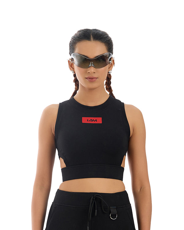 Electro Waist Cut Crop Top, a black ribbed knit crop top with a high neckline and a distinctive geometric cutout at the