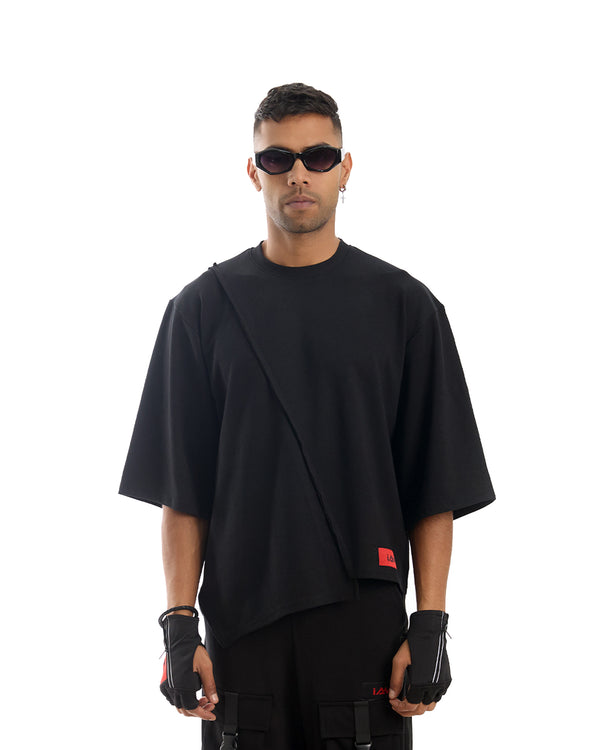 Rift Asymmetric T-shirt: Black cotton tee with a distressed, ripped hem and a single shoulder strap.
