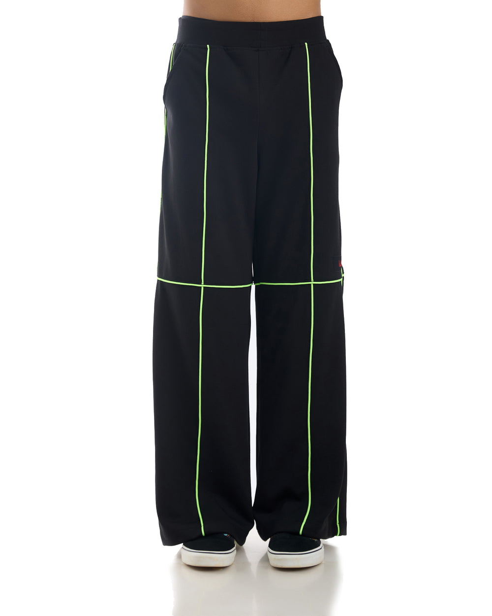 Close-up of the Neon Hoion Pants showing the vibrant neon green fabric and black accents.