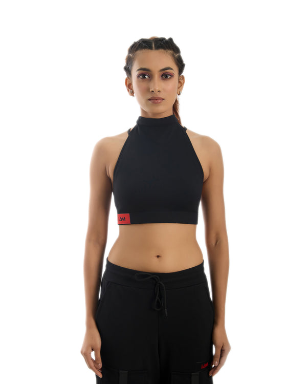 Multiverse Backless Top: A white, sleeveless crop top with a plunging neckline and delicate shoulder straps.