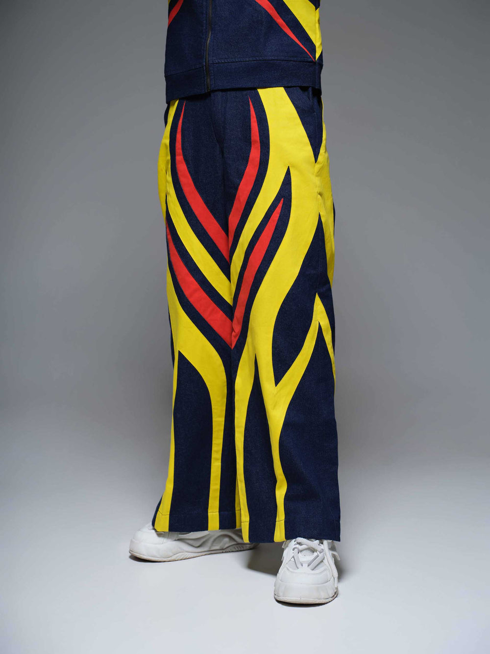 The Blaze Bull Pants feature a dark wash denim with a subtle bull embroidery on the back pocket.