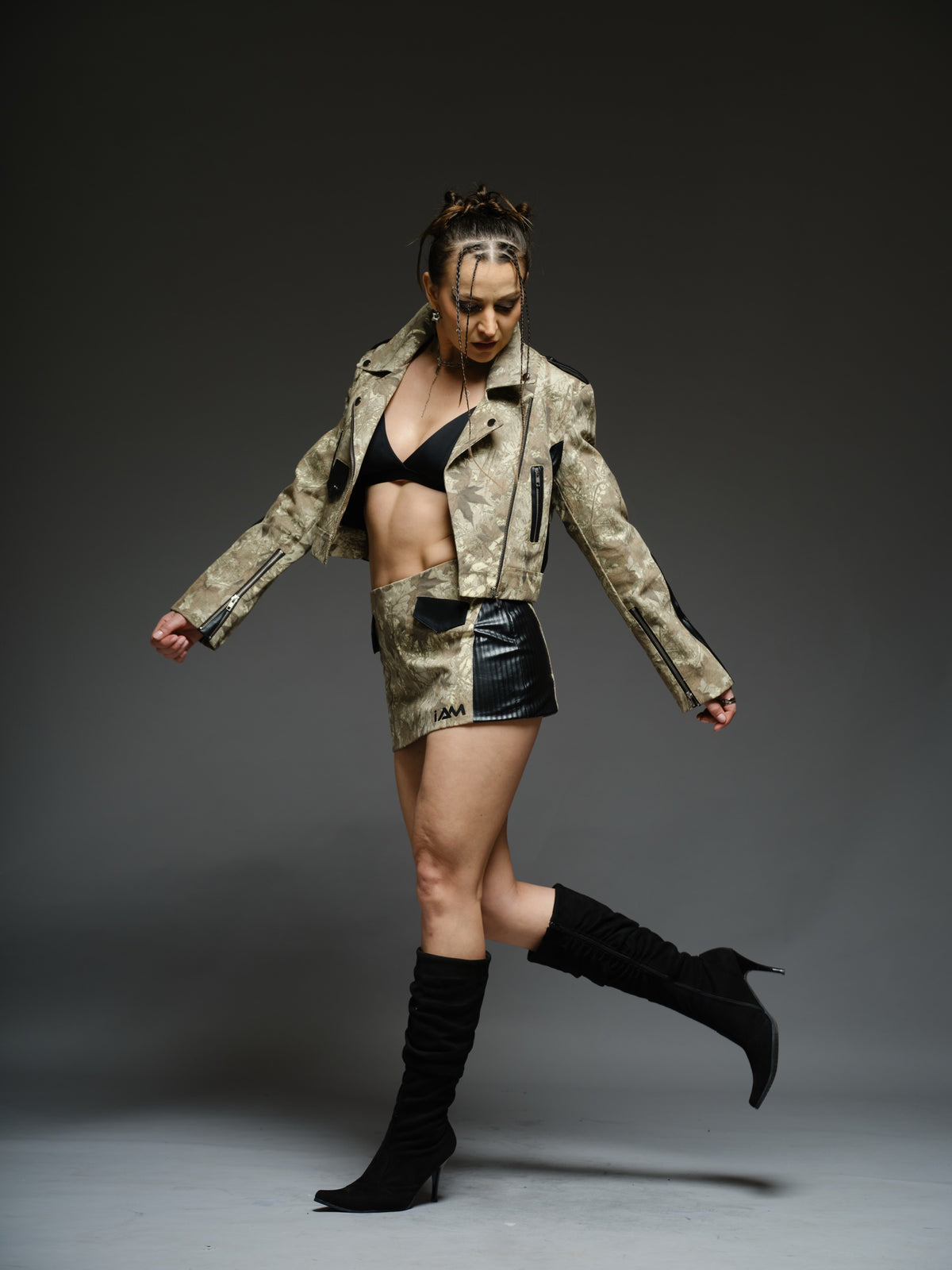 Camouflage-style denim cropped biker jacket and mini skirt with black ribbed leather panels and metal hardware