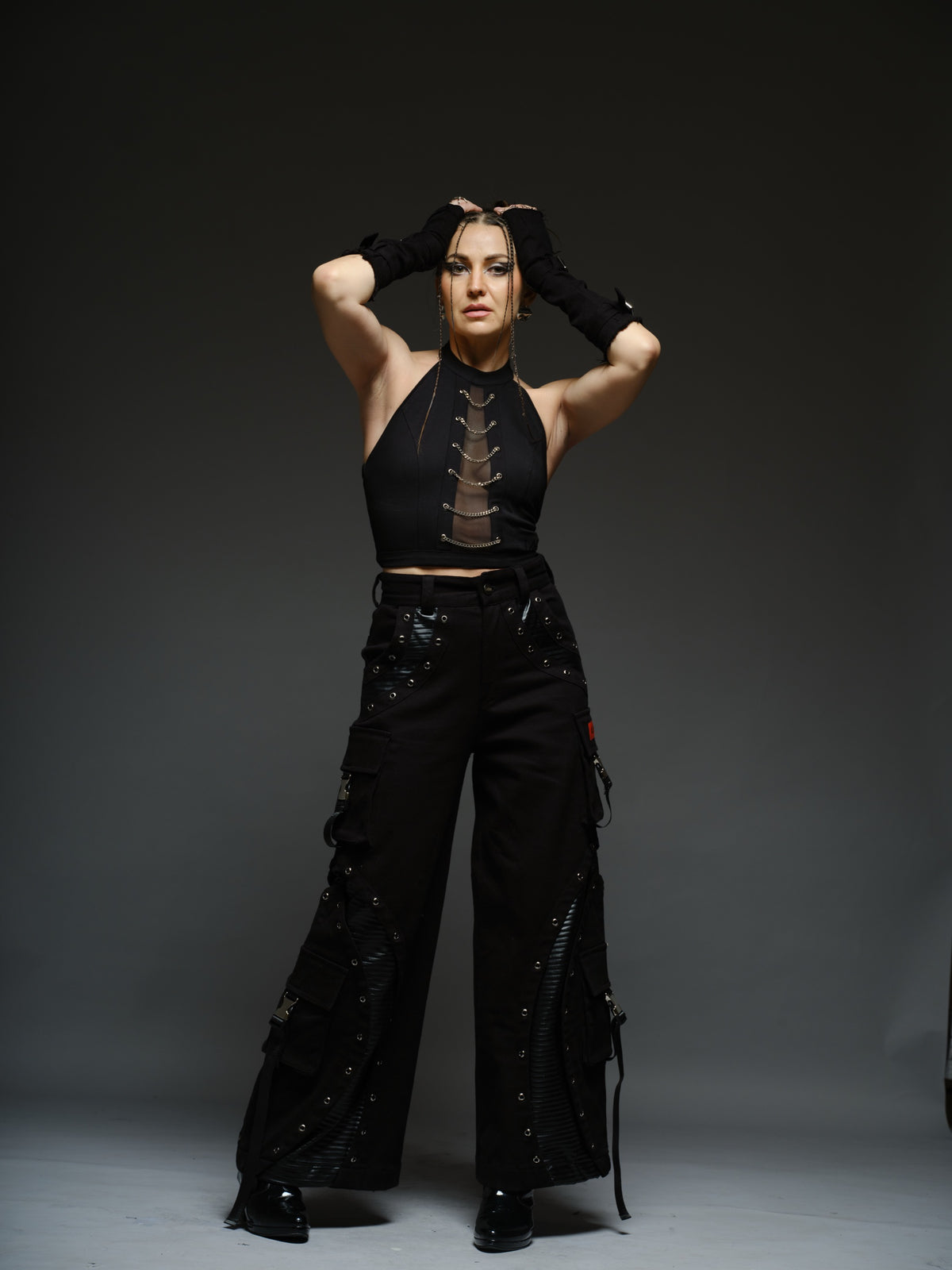 Witching Hour black halter top with a sheer centre-front mesh panel and six silver-tone chains