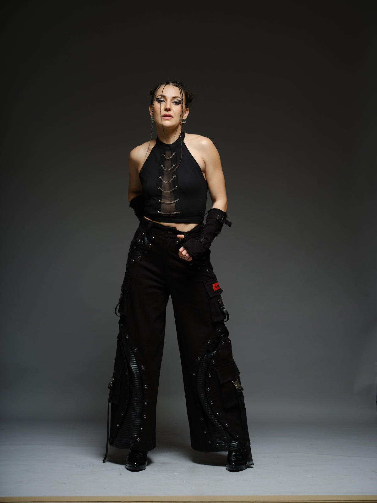 Witching Hour black halter top with a sheer centre-front mesh panel and six silver-tone chains