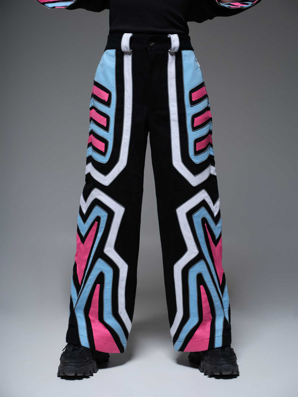 Close-up of red Bubble Vroom Pants with a white bubble print and black waistband.