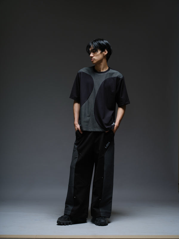 Black Roma knit short-sleeve tee with curved grey net panels across the shoulders and front