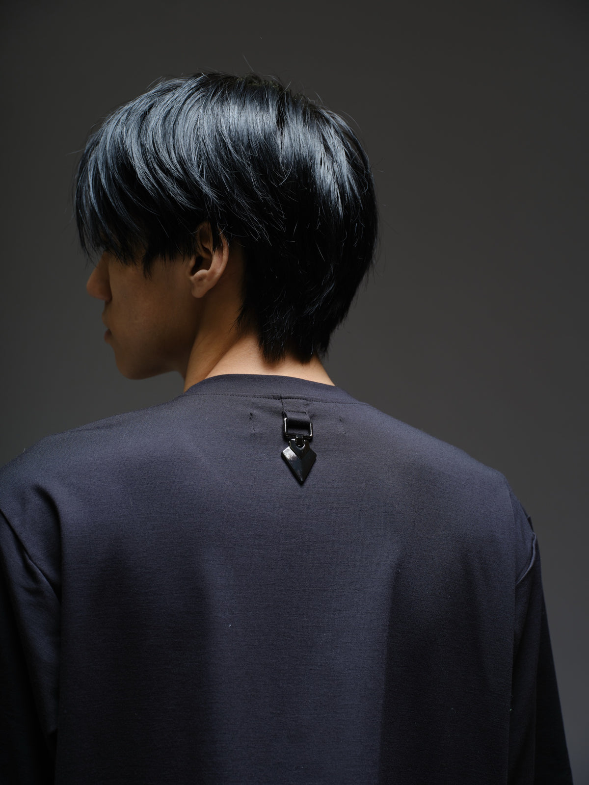 Black Roma knit short-sleeve tee with curved grey net panels across the shoulders and front