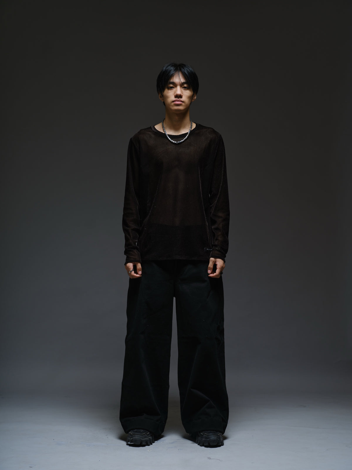 Black velvet mesh long sleeve tee with a relaxed fit, sheer finish and round neckline