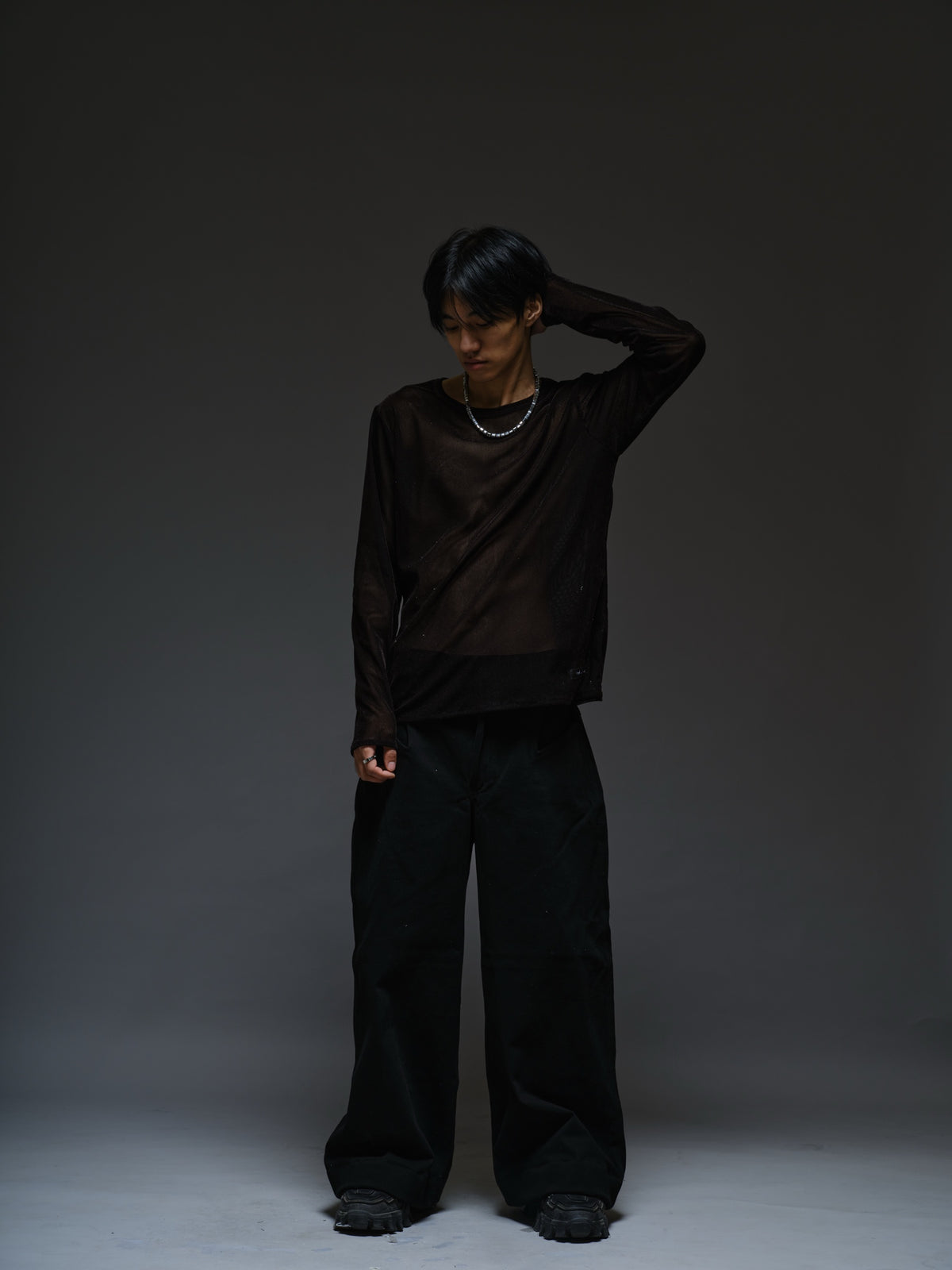 Black velvet mesh long sleeve tee with a relaxed fit, sheer finish and round neckline