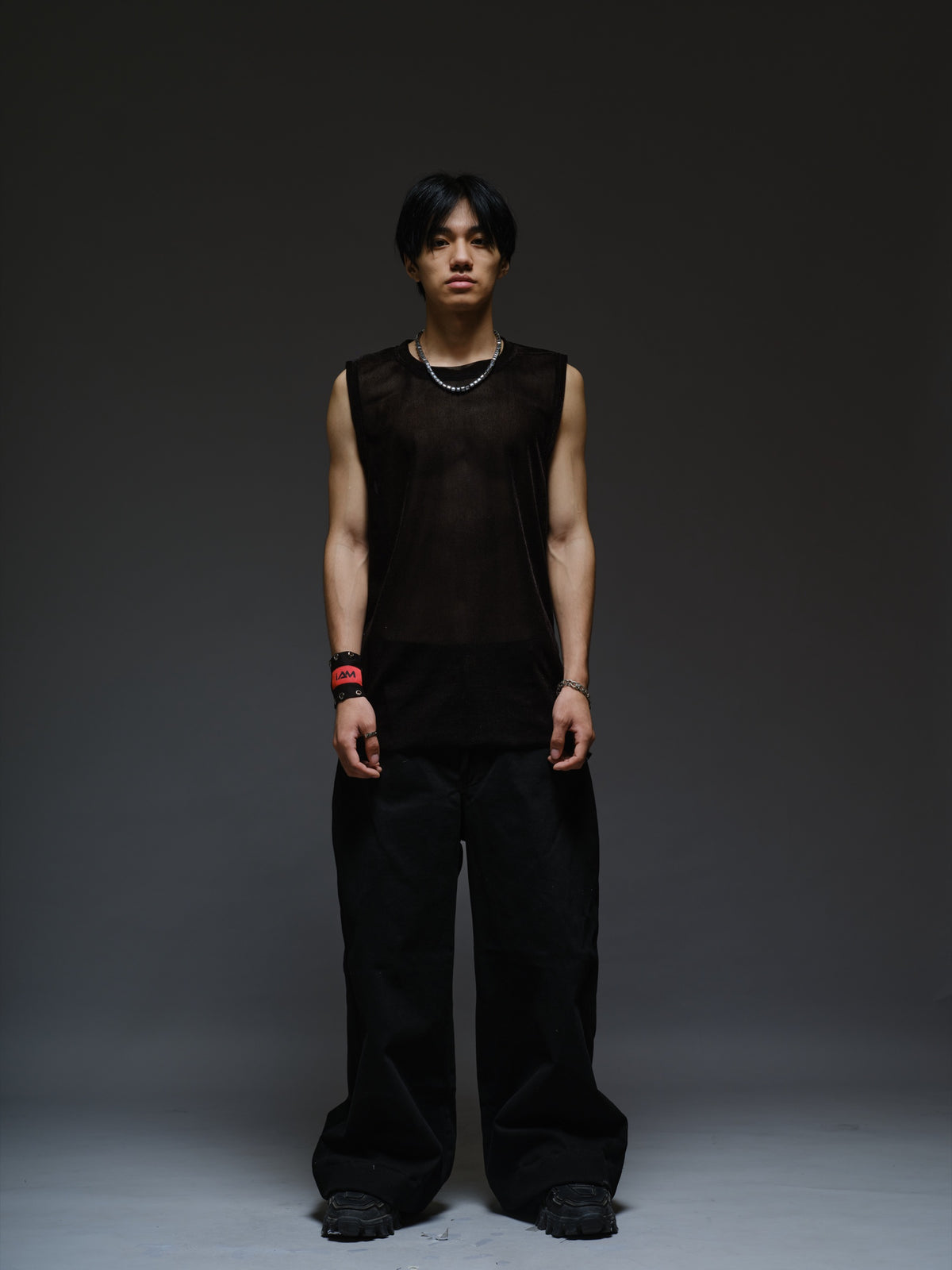Black velvet mesh sleeveless tank with a relaxed fit, broad shoulders and a round neckline