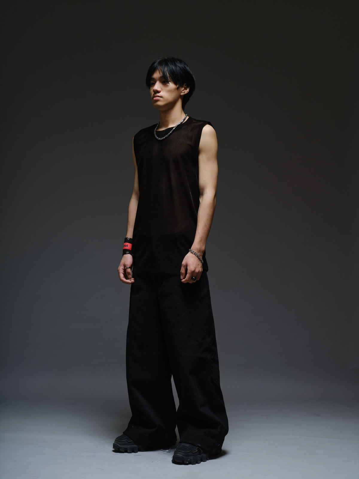 Black velvet mesh sleeveless tank with a relaxed fit, broad shoulders and a round neckline
