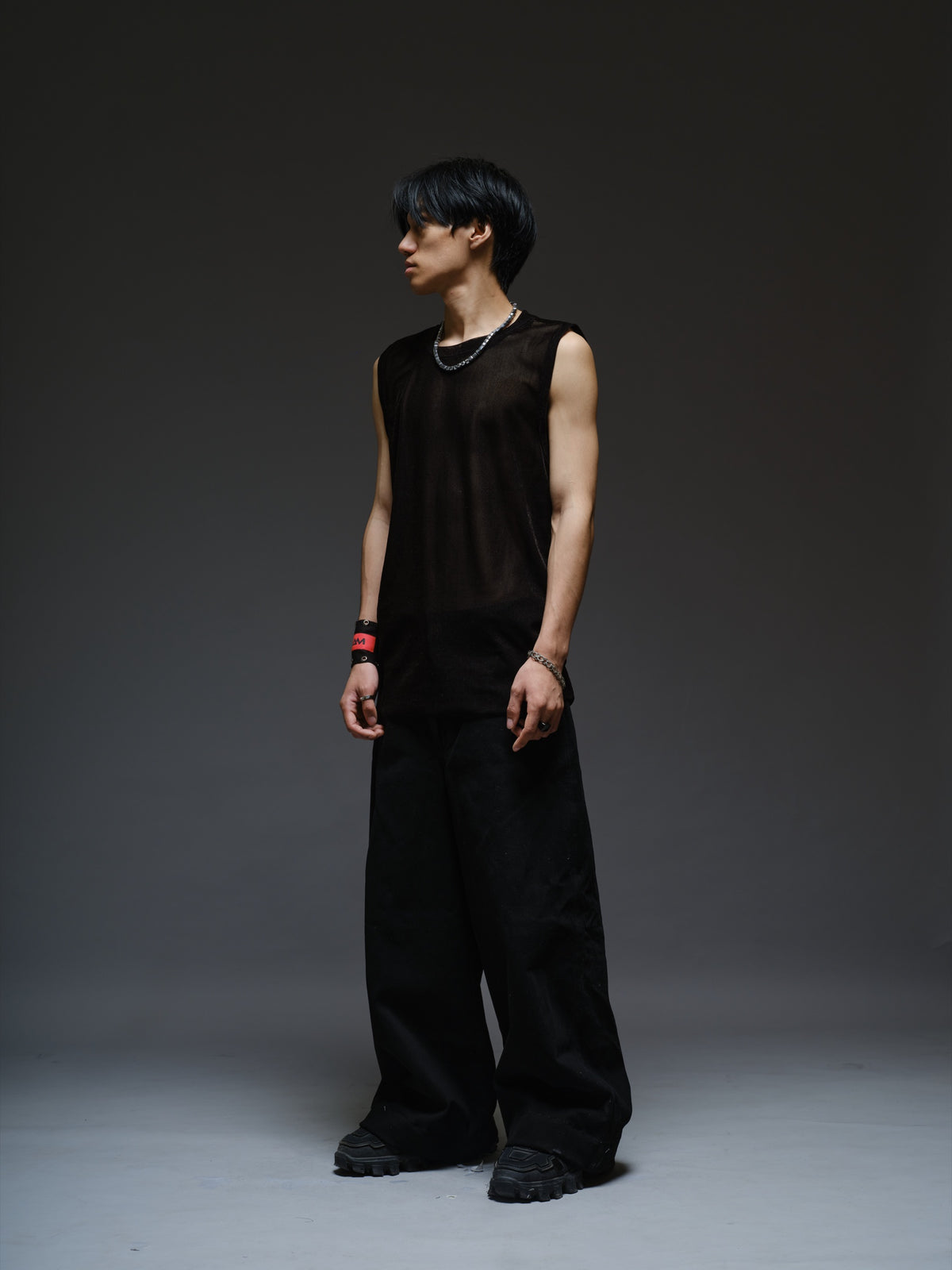 Black velvet mesh sleeveless tank with a relaxed fit, broad shoulders and a round neckline