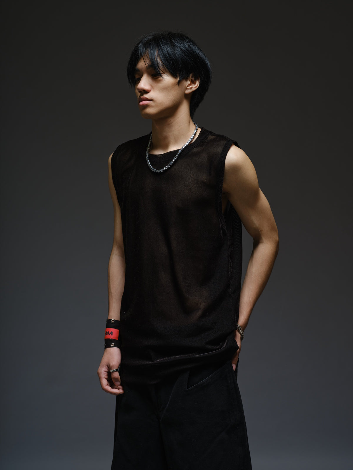 Black velvet mesh sleeveless tank with a relaxed fit, broad shoulders and a round neckline