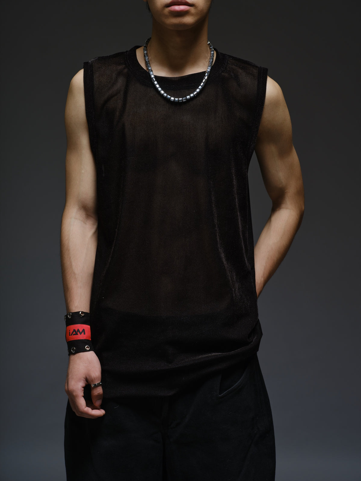 Black velvet mesh sleeveless tank with a relaxed fit, broad shoulders and a round neckline