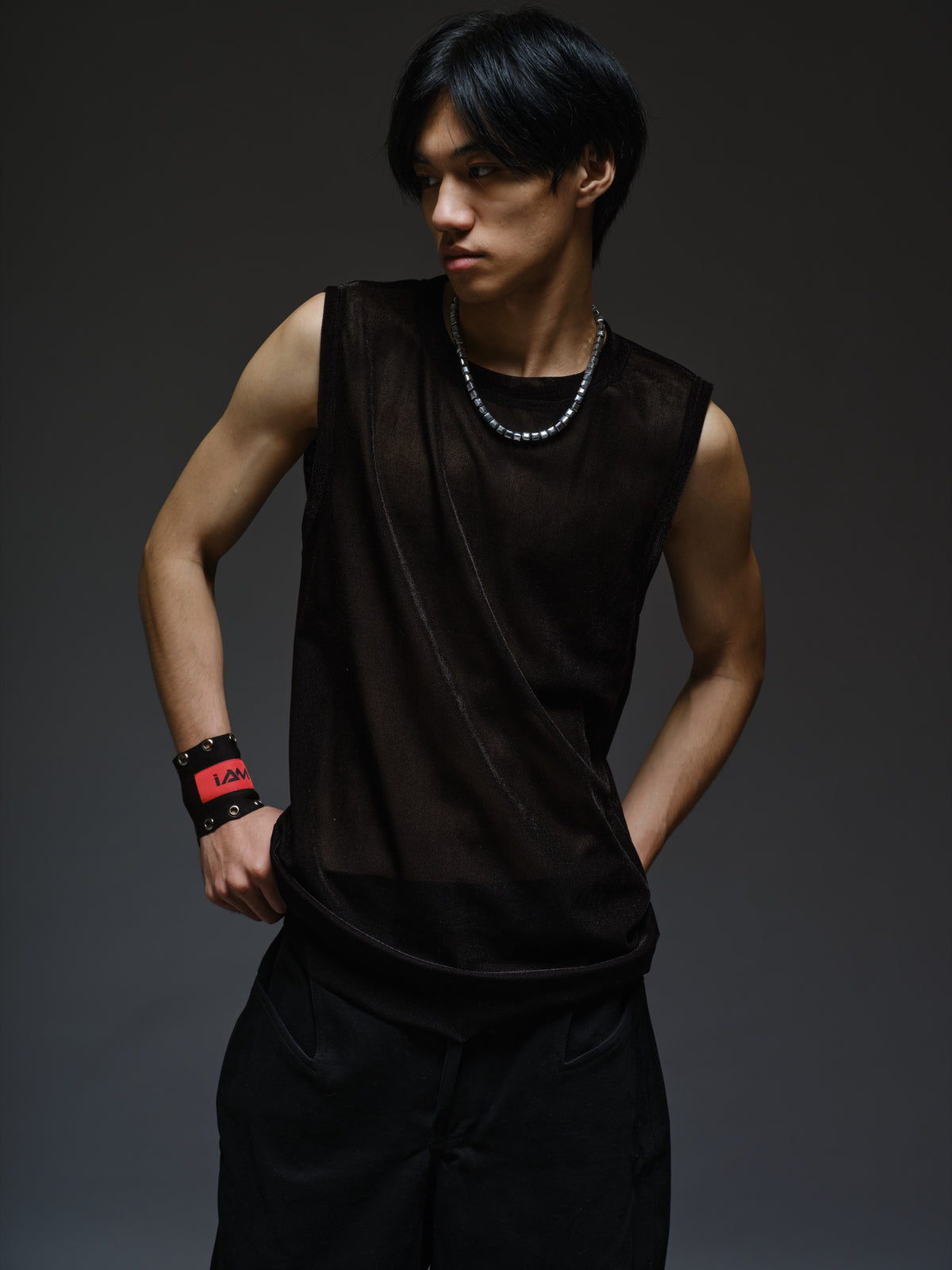 Black velvet mesh sleeveless tank with a relaxed fit, broad shoulders and a round neckline