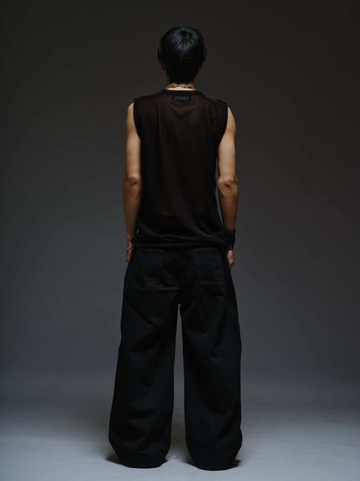 Black velvet mesh sleeveless tank with a relaxed fit, broad shoulders and a round neckline