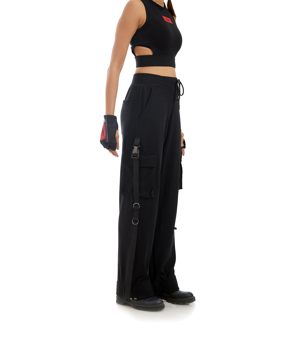 Holo Harbor Tech Pants displayed on a mannequin, showcasing their sleek, dark fabric and modern silhouette.