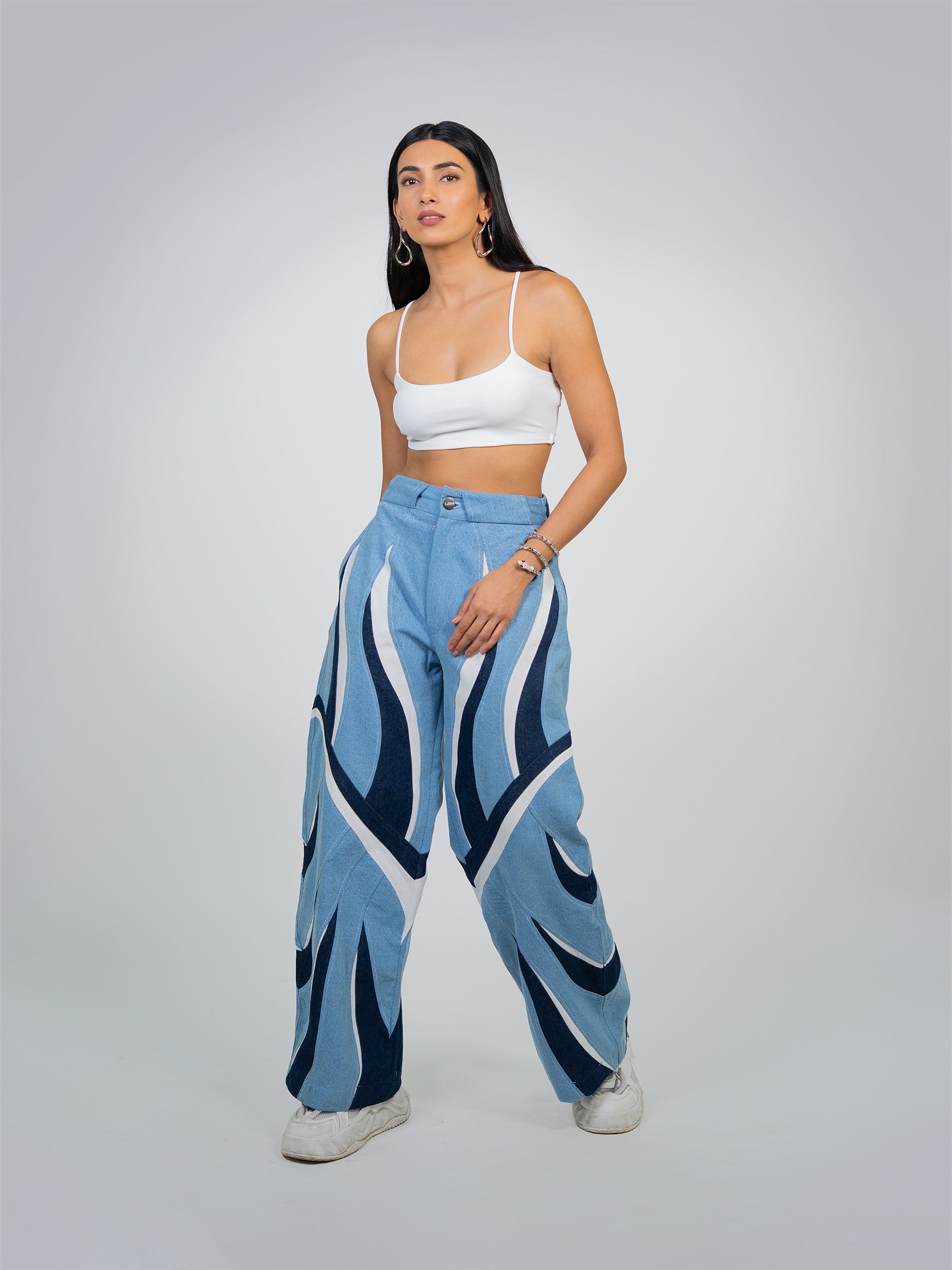 ECLIPSE FLAME PANTS: Black pants with bold red and orange flame graphics down the sides.