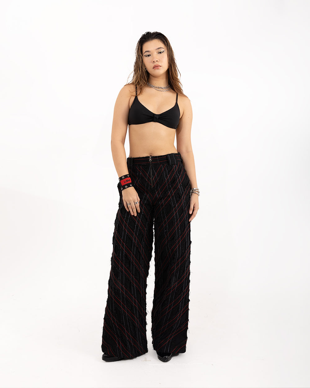 Rope Grid Pants featuring a unique woven texture in a dark, neutral color, offering a stylish and modern look.
