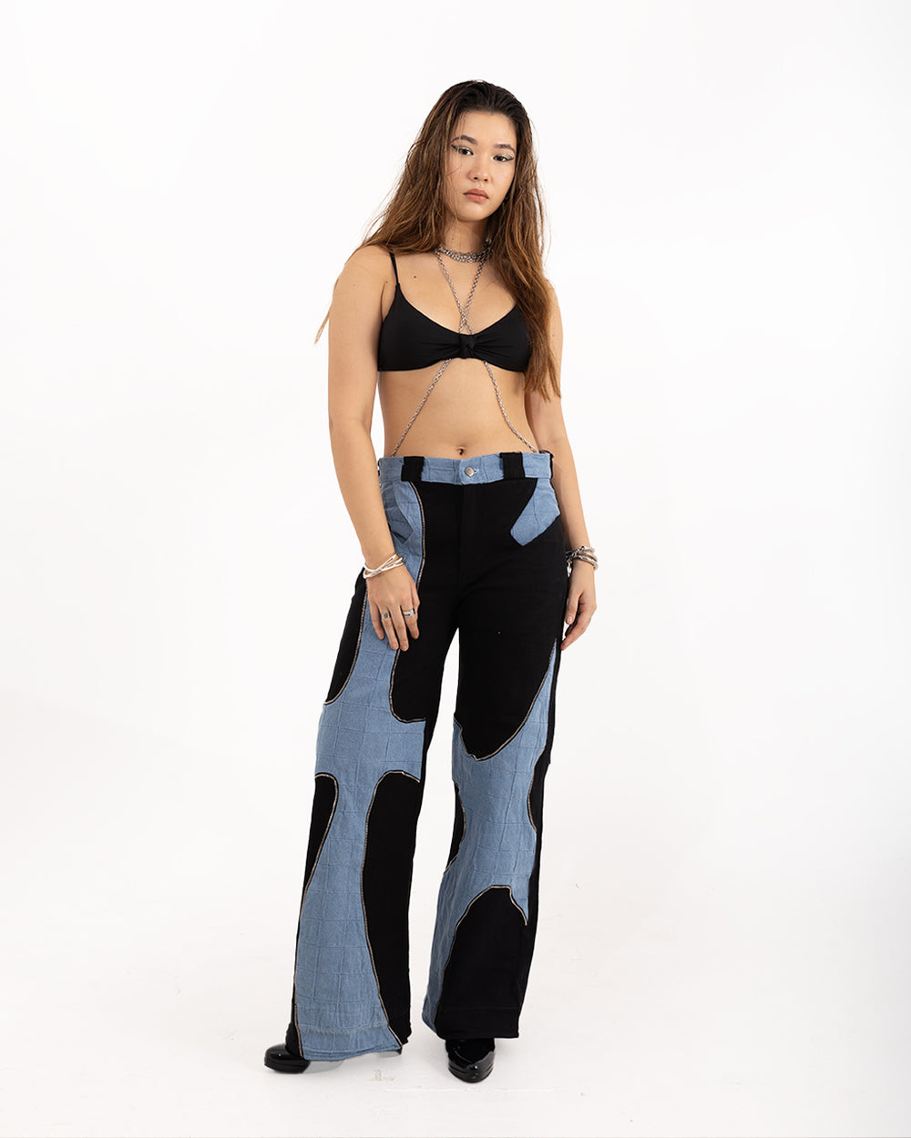 Blue Wave Pants by [Brand Name] - close-up of textured blue fabric with wave-like patterns.