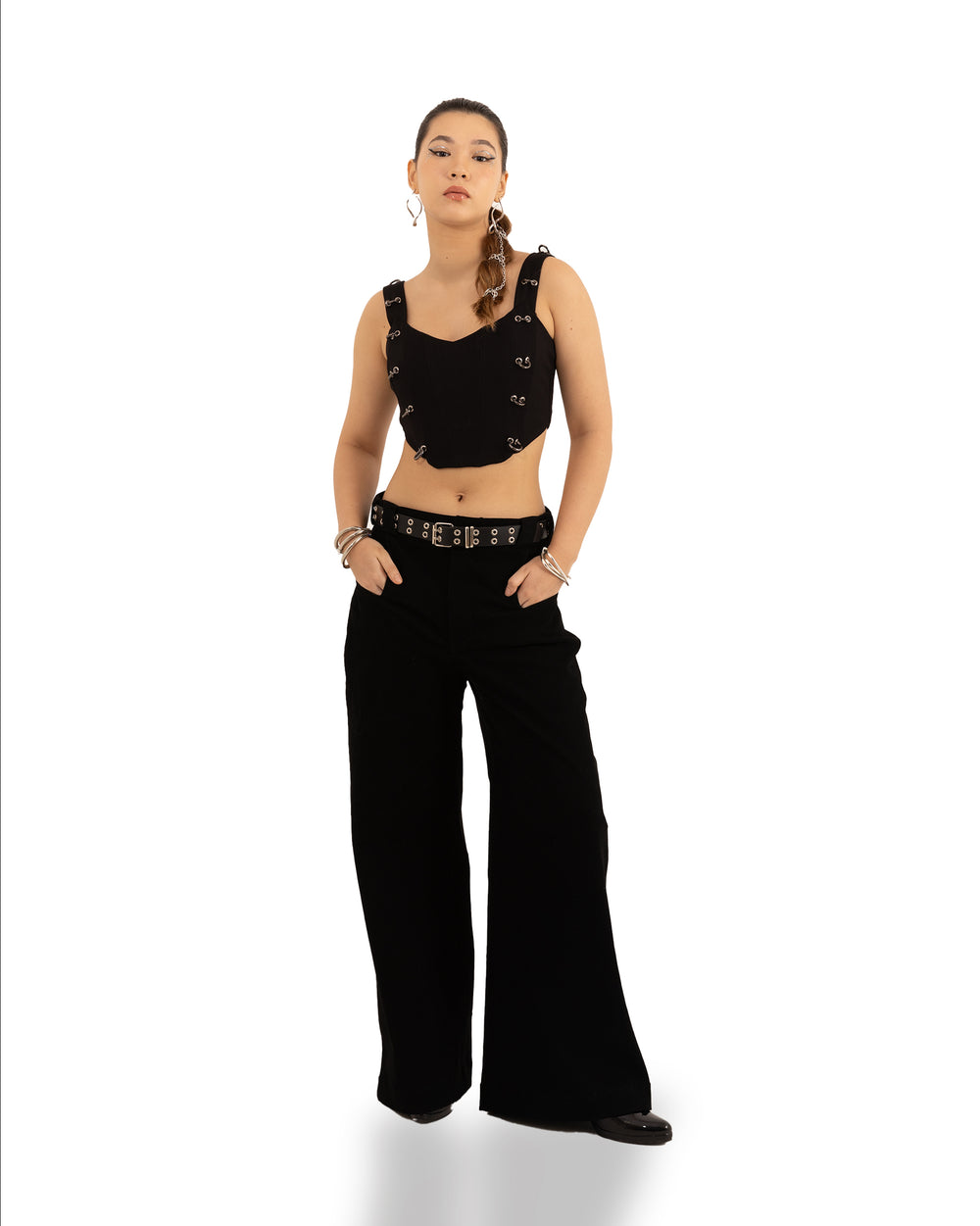 Modulator Corset Top: A black, structured corset top with boning and a lace-up back detail.